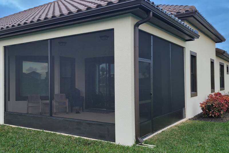 custom patio enclosure installation in Ocala, FL attached to modern residential home